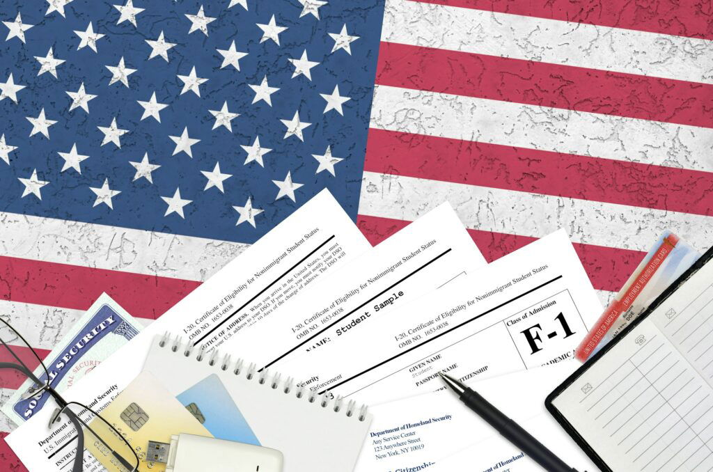 USCIS form I-20 Certificate of eligibility for nonimmigrant student status lies on flat lay office